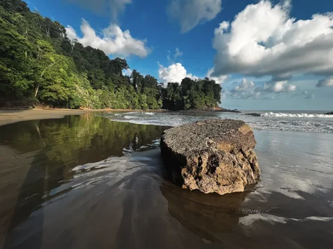 A dramatic rock formation on the sand at Playa Arco, part of Marino Ballena National Park near Ojochal, Costa Rica