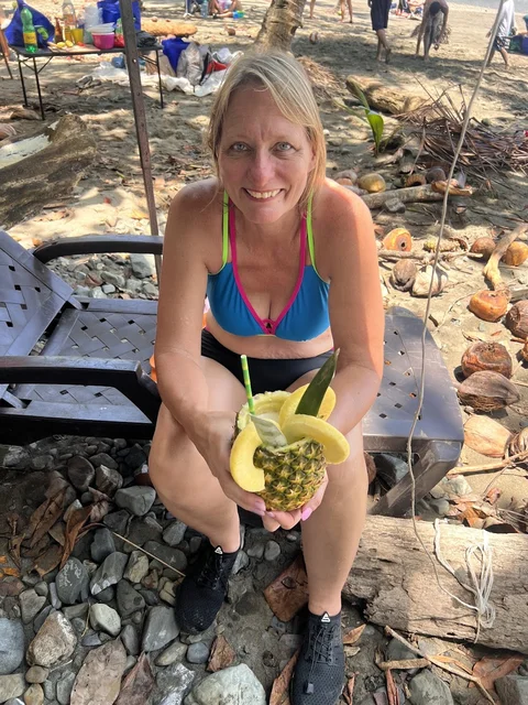A fresh pineapple served as a drink cup on the beach near Playa Ventanas