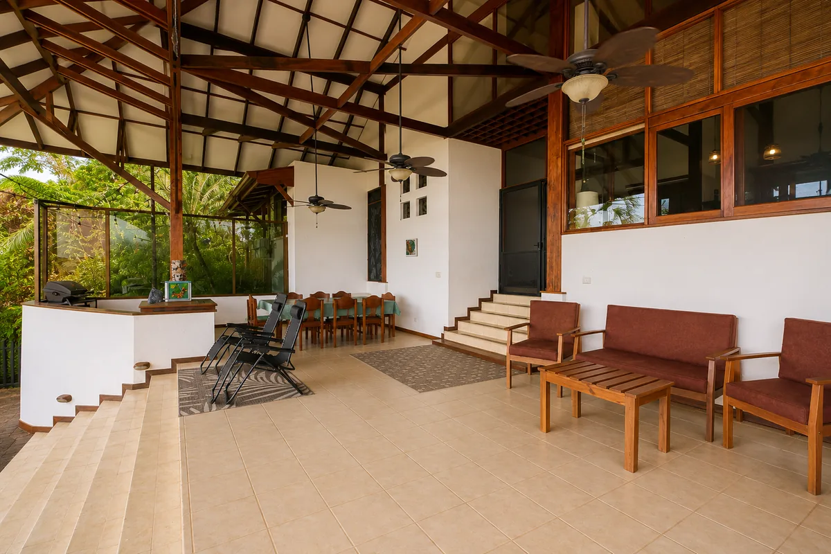 View from the covered terrace back toward the kitchen counter, stairs and living area, showing how the spaces connect